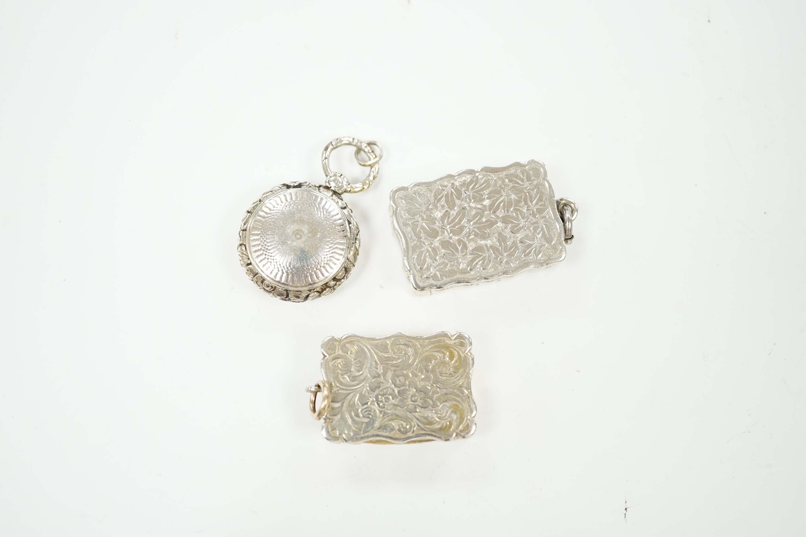 Three assorted 19th century silver vinaigrettes including circular and late Victorian by George Unite, Birmingham, 1898, 33mm.